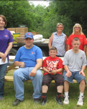 TMMK paint team presenting a donation to Caring Hearts in KY